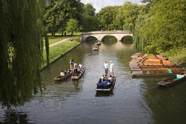 People punting in small boats on the River Cam, Cambridge England