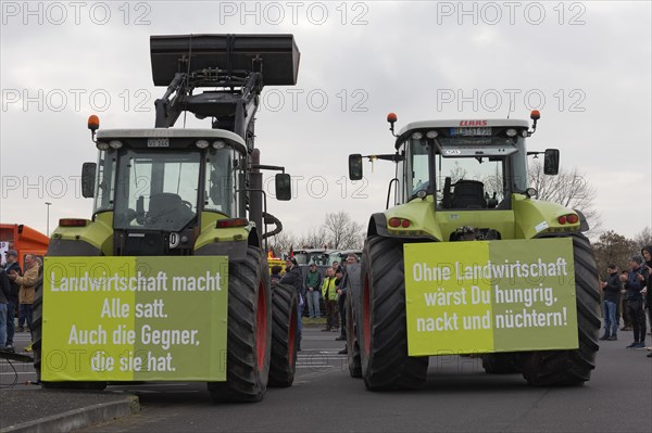 Tractors with posters on agriculture, farmers' protests, demonstration against the policies of the traffic light government, abolition of agricultural diesel subsidies, Duesseldorf, North Rhine-Westphalia, Germany, Europe