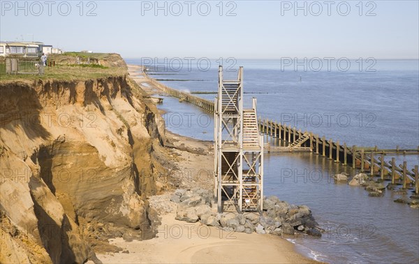 Former beach access stairs now stand alone as coastal erosion continues, Happisburgh, Norfolk, England, United Kingdom, Europe