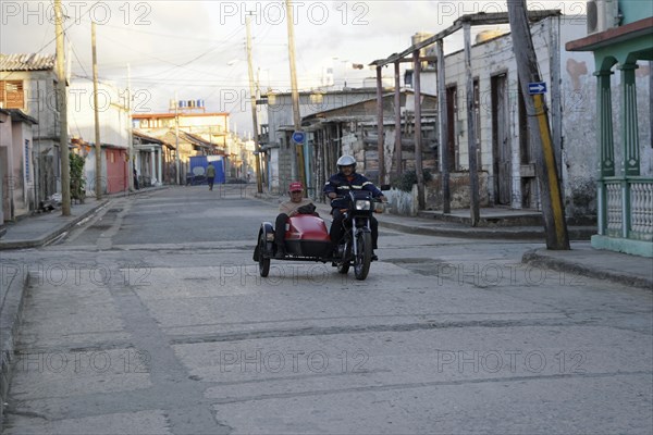 Motorbike with sidecar on the road in Baracao, Cuba, Central America