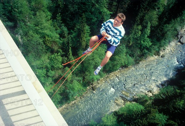 Man jumping from Bridge Echelsbacher Brucke, river Ammer, Murnau, Upper Bavaria, Germany, vintage, retro, Europe