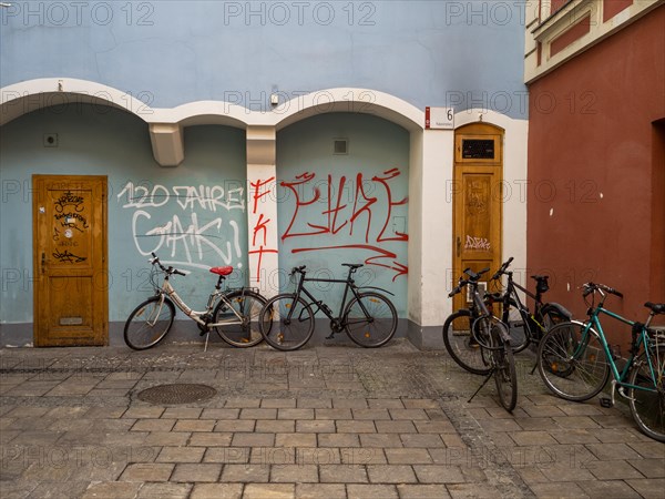 Bicycles leaning against a house wall, graffiti, Graz, Styria, Austria, Europe