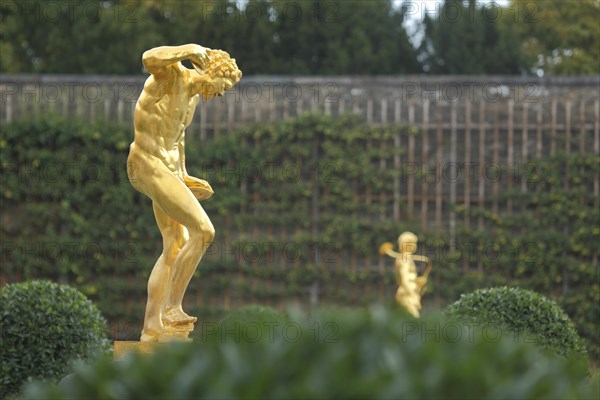 Satyr with cymbal as golden statue, sculpture, golden, cymbal player, shining, shining, orangery, castle garden, Weilburg, Taunus, Hesse, Germany, Europe