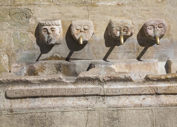 Stone water fountain faces village of Grazalema, Cadiz province, Spain, Europe