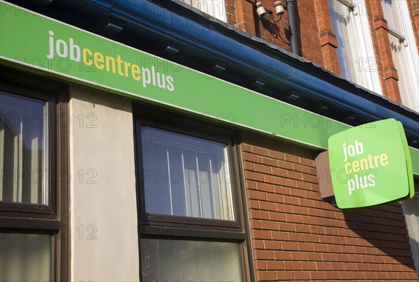 Close up of Job Centre Plus green signs on wall, England, UK