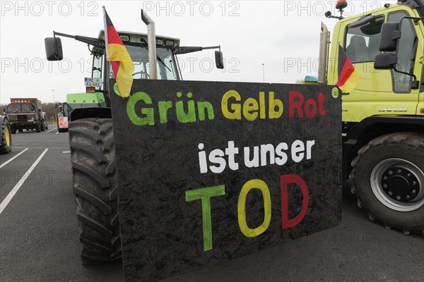 Tractor with sign, Green Yellow Red is our death, farmer protests, demonstration against the policy of the traffic light government, abolition of agricultural diesel subsidies, Duesseldorf, North Rhine-Westphalia, Germany, Europe