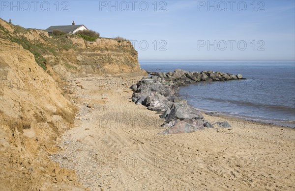 Rock armour used to defend soft crumbling cliffs, Happisburgh, Norfolk, England, United Kingdom, Europe