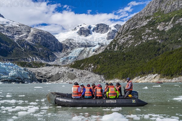 Passengers of the cruise ship Stella Australis in rubber dinghies in front of the ice of the Porter Glacier, Alberto de Agostini National Park, Avenue of the Glaciers, Chilean Arctic, Patagonia, Chile, South America