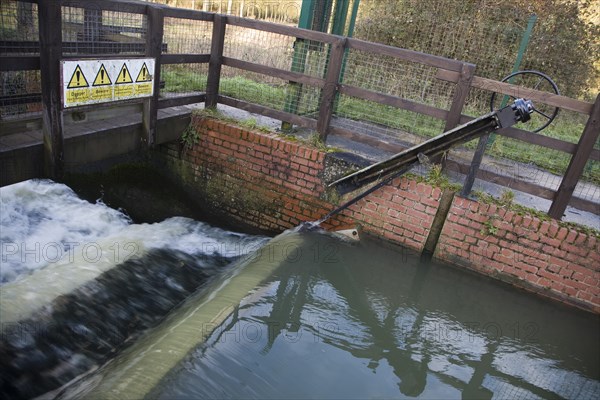 Whitebridge weir on the River Deben, Campsea Ashe, Suffolk England is a simple mechanical device to regulate river flow between the seasons