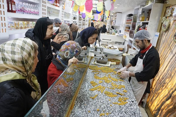 Sweet pastries, nuts and spices in a bazaar in Tehran, Iran, 09/03/2019, Asia