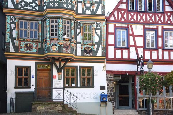 Entrance to the Killingerhaus with oriel and decorations, post letterbox, half-timbered house, arts and crafts, painting, Koenig-Adolf-Platz, Idstein, Taunus, Hesse, Germany, Europe