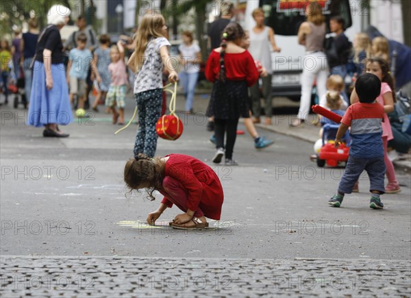 Temporary play street in Berlin Kreuzberg, children playing on a closed street in Berlin, 07.08.2019