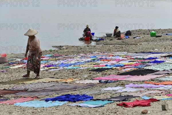 Washing clothes in the Irrawaddy, Myanmar, Asia