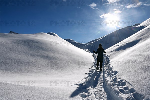 Snowshoe hiking in the Beverin nature park Park, Graubuenden, Switzerland, Europe