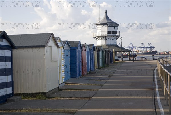 Colourful seaside beach huts and Low lighthouse maritime museum, Harwich, Essex, England, United Kingdom, Europe