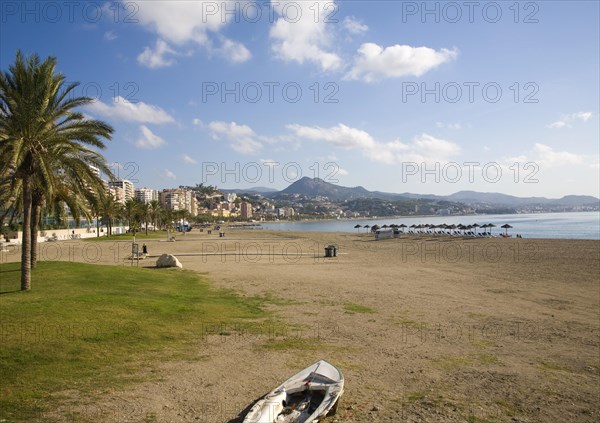 Sandy beach in front of apartment blocks in the city of Malaga, Spain, Europe