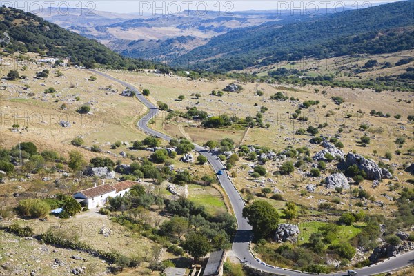 Road running through landscape in Sierra de Grazalema natural park, Cadiz province, Spain, Europe