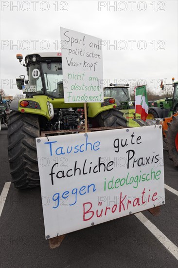Tractor with sign against ideological bureaucracy, farmers' protests, demonstration against policies of the traffic light government, abolition of agricultural diesel subsidies, Duesseldorf, North Rhine-Westphalia, Germany, Europe