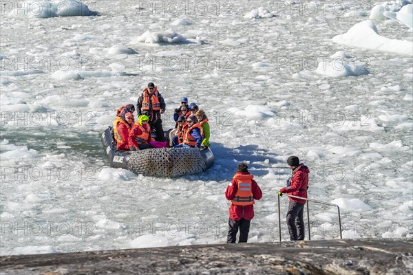 Passengers on the Stella Australis cruise ship travelling through ice floes to Pia Glacier, Alberto de Agostini National Park, Avenue of Glaciers, Chilean Arctic, Patagonia, Chile, South America