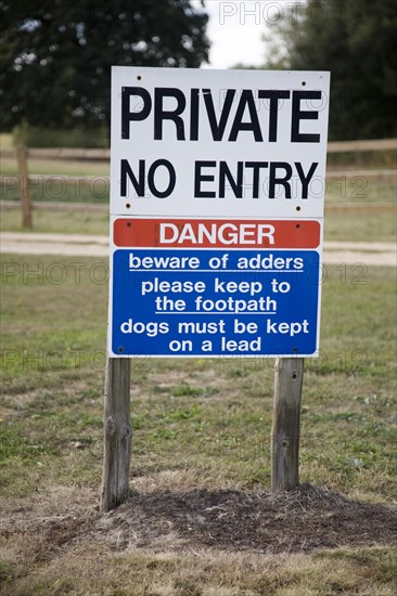 Private No entry sign warning of adder snakes, Wantisden, Suffolk, England, United Kingdom, Europe