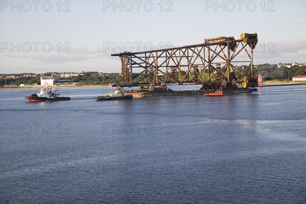 Large North Sea oil drilling platform leaving the River Tyne, Tynemouth, Northumberland, England, United Kingdom, Europe