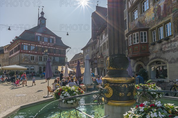 Stein am Rhein, historic old town, town hall, town hall square, murals, fountain, inn, half-timbered house, bay window, backlight, Canton Schaffhausen, Switzerland, Europe