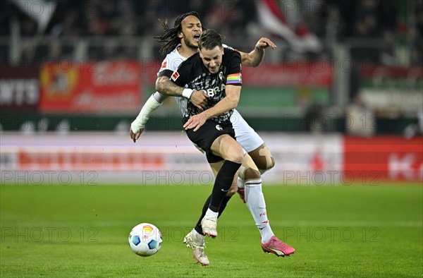 Tackle, action Christian Guenter SC Freiburg SCF (30) against Kevin Mbabu FC Augsburg FCA (43) WWK Arena, Augsburg, Bavaria, Germany, Europe