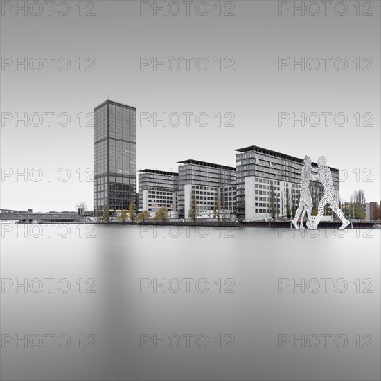 The Treptowers and the Denkaml Molecule Men in Berlin Treptow on the Spree at the Blue Hour