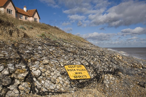 Coastal defences normally covered by shingle exposed by winter storms at Thorpeness, Suffolk, England in November 2013