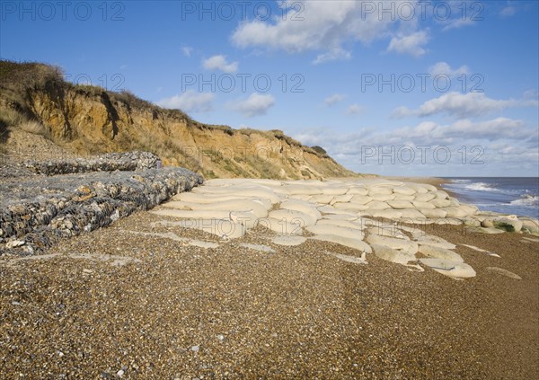 Coastal defences normally covered by shingle exposed by winter storms at Thorpeness, Suffolk, England in November 2013