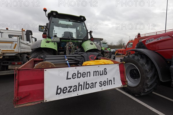 Life must be affordable, banner on a tractor, farmers' protests, demonstration against policies of the traffic light government, abolition of agricultural diesel subsidies, Duesseldorf, North Rhine-Westphalia, Germany, Europe