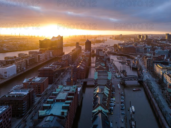 Aerial view of Hamburg harbour at sunset with Speicherstadt warehouse district and Elbe Philharmonic Hall concert hall, Hamburg, Germany, Europe