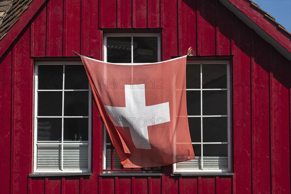 Stein am Rhein, old town, wooden house, colour red, swiss flag, wind, canton Schaffhausen, Switzerland, Europe