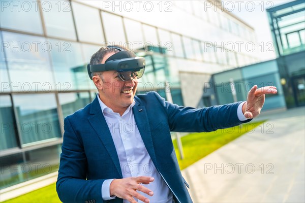 Businessman enjoying using augmented vision glasses outside the office financial building