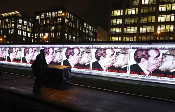 On the 30th anniversary of the fall of the Berlin Wall, 3D video projections of historical images and videos commemorate the events of the Peaceful Revolution and the opening of the Wall at original locations, such as here at the East Side Gallery, where the kiss between Brezhnev and Honecker can be seen, Berlin, 6 November 2019