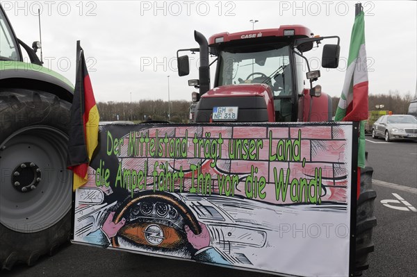 Sign with the theme Mittelstand on a tractor, farmers' protests, demonstration against the policy of the traffic light government, abolition of agricultural diesel subsidies, Duesseldorf, North Rhine-Westphalia, Germany, Europe