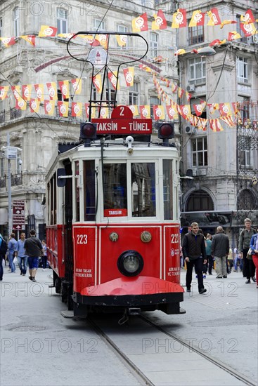 Historic tram Nostaljik Tramvay travelling through Istiklal Caddesi shopping street, Beyoglu, Istanbul, European part, Istanbul province, Turkey, Asia
