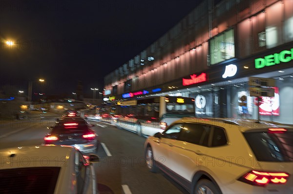 Evening traffic at a shopping centre, wiping effect, Erlangen, Middle Franconia, Bavaria, Germany, Europe