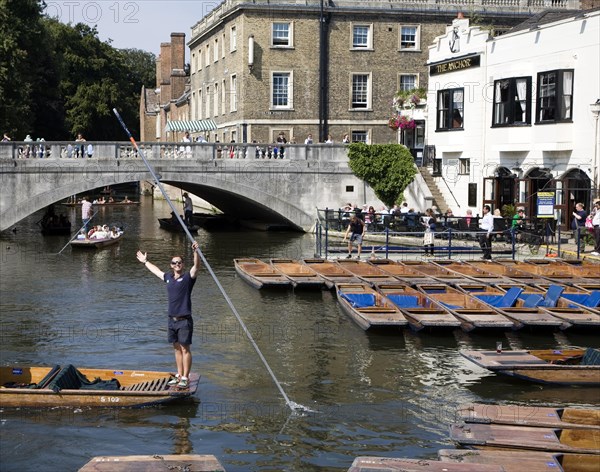 People punting in small boats on the River Cam near Silver Street Bridge, Cambridge, England, United Kingdom, Europe