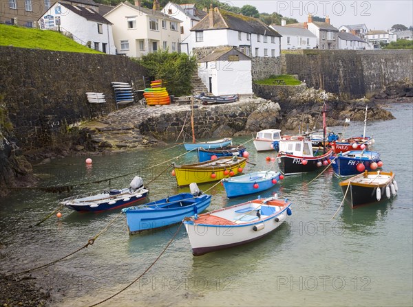 Small fishing boats in the harbour at the village of Coverack on the Lizard peninsula, Cornwall, England, United Kingdom, Europe