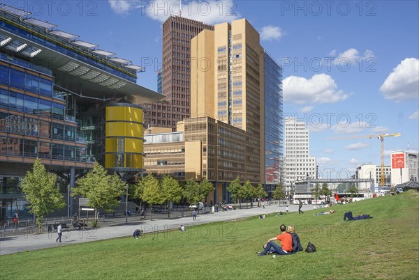 People sitting in a meadow at Potsdamer Platz, Berlin, 06/09/2019