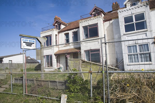 Houses abandoned and derelict awaiting demolition because of coastal erosion, Happisburgh, Norfolk, England, United Kingdom, Europe