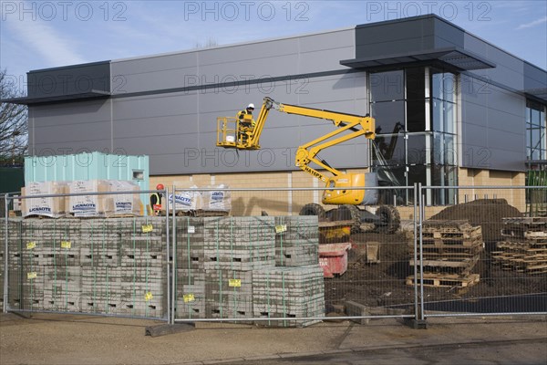 Cherry picker crane at construction site, UK