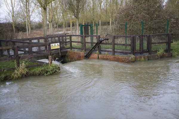 Whitebridge weir on the River Deben, Campsea Ashe, Suffolk England is a simple mechanical device to regulate river flow between the seasons