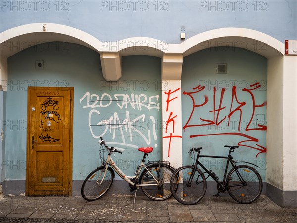 Bicycles leaning against a house wall, graffiti, Graz, Styria, Austria, Europe