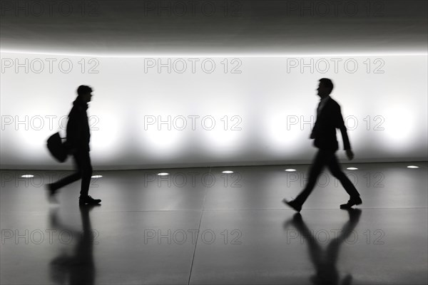 Members of the German Bundestag walk through a tunnel. The tunnel connects the Reichstag and the Paul Loebe Haus, Berlin, 13 November 2018