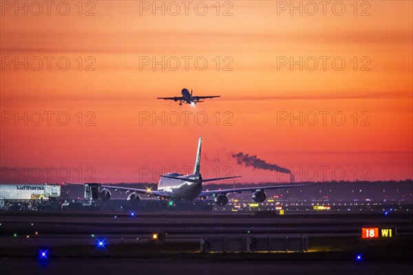 Early in the morning at the airport in front of sunrise, a Boeing 747 aircraft stands ready for take-off on the runway, Fraport, Frankfurt am Main, Hesse, Germany, Europe