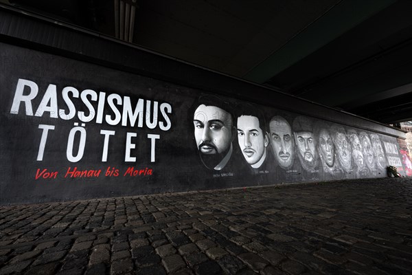 A 27-metre-long memorial graffito under the Friedensbruecke bridge in Frankfurt commemorates the victims of the attack in Hanau on 19 February 2020, Friedensbruecke, Frankfurt am Main, Hesse, Germany, Europe