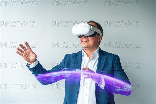 Smiling confident businessman with VR goggles touching interactive screen in office