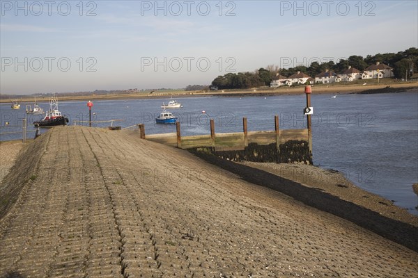 Concrete inclined sea wall embankment River Deben, Felixstowe Ferry, Suffolk, England, United Kingdom, Europe